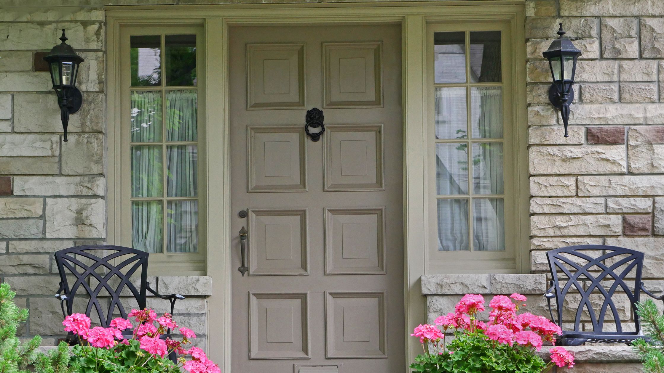 Front entry of a GTA home with a modern door and side windows, showcasing the benefits of installing a new front door for curb appeal and efficiency.